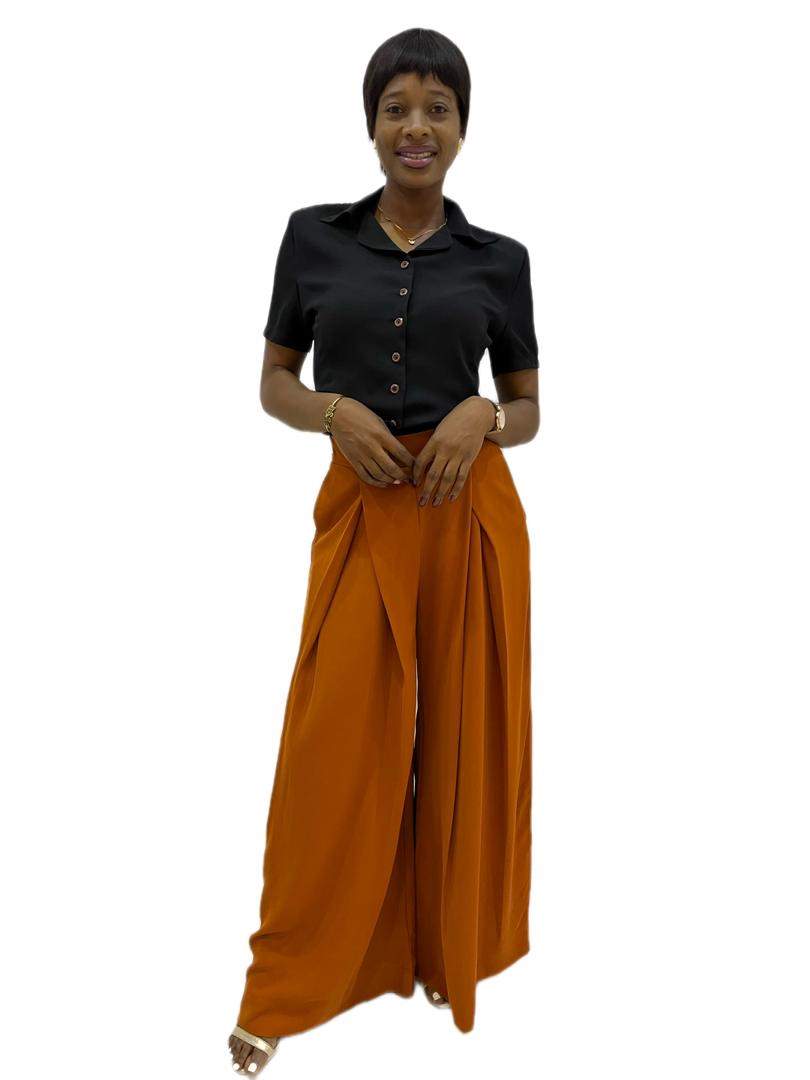 Wide leg orange trouser with luxe sculpted pleat detail