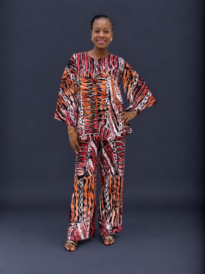 White orange and black adire cape like top and trouser with slit sleeves
